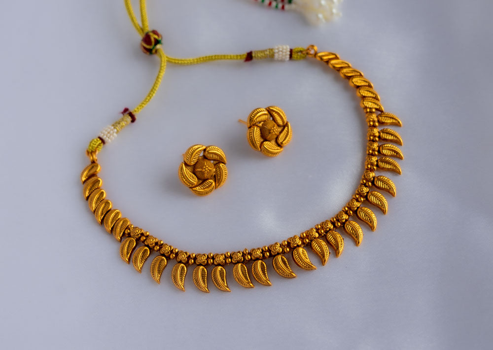 Tarini Golden Leaf necklace with earrings